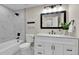 Elegant bathroom with marble tiling, modern fixtures, and a pristine vanity at 10431 Holland St, Broomfield, CO 80021