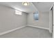 A carpeted bedroom features trim, small windows and a sliding closet door at 10431 Holland St, Broomfield, CO 80021