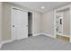 Bedroom with carpet, closet, and a view into a bathroom at 10431 Holland St, Broomfield, CO 80021
