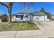 Charming single Gathering home with a well-manicured front yard and two-car garage at 10431 Holland St, Broomfield, CO 80021