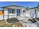 Inviting front entrance with a stylish blue door and a well-maintained walkway at 10431 Holland St, Broomfield, CO 80021