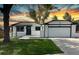 Charming single Gathering home featuring a landscaped front yard and an attached two-car garage at 10431 Holland St, Broomfield, CO 80021