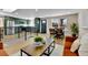 Open-concept living space with modern decor, wood floors, and natural light from large windows at 10431 Holland St, Broomfield, CO 80021