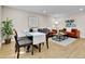 Cozy living space featuring a glass dining table with seating and comfortable sofas at 10431 Holland St, Broomfield, CO 80021
