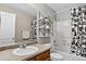Bathroom features a combined bathtub and shower, plus stylish black and white accents at 425 Peabody St, Castle Rock, CO 80104