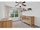 Bright bedroom with wooden crib, accent shelves, and light-filled window at 425 Peabody St, Castle Rock, CO 80104