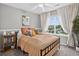Cozy bedroom features a black metal bedframe, and large window with neighborhood views at 425 Peabody St, Castle Rock, CO 80104