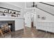 Modern living room with beautiful hardwood floors, a fireplace, and custom shelving at 425 Peabody St, Castle Rock, CO 80104