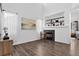 Bright living room featuring a fireplace and ample natural light from large windows at 425 Peabody St, Castle Rock, CO 80104