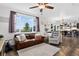 Open-concept living room with hardwood floors, a modern kitchen, and comfortable seating at 425 Peabody St, Castle Rock, CO 80104