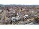 An aerial view of a neighborhood with modern homes, well-maintained streets, and mountain views in the background at 2723 Grove St, Denver, CO 80211