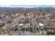 Stunning aerial view of homes with the Rocky Mountains in the background on a sunny day at 2723 Grove St, Denver, CO 80211