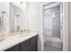 Clean bathroom with modern fixtures, a spacious vanity, and a separate shower and tub at 2723 Grove St, Denver, CO 80211