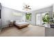 Spacious bedroom with natural light, a ceiling fan, and access to outdoor space through glass doors at 2723 Grove St, Denver, CO 80211
