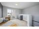 Bright bonus room with a sink, sliding glass doors to patio, and stairs leading up or down at 2723 Grove St, Denver, CO 80211