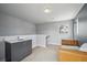 Cozy bonus room with a small sink area, a window providing natural light, and comfortable seating at 2723 Grove St, Denver, CO 80211