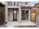 Front entrance with modern door and sliding glass door plus landscaped yard at 2723 Grove St, Denver, CO 80211