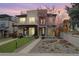 Contemporary two-story home featuring a landscaped front yard and a rooftop deck at 2723 Grove St, Denver, CO 80211