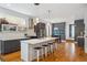 Bright, open kitchen features a large island, stainless steel appliances, and hardwood floors at 2723 Grove St, Denver, CO 80211
