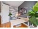A bright office with modern desk, decor, and a wood accent wall at 2723 Grove St, Denver, CO 80211