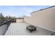 Expansive roof deck with a fire pit, offering panoramic views and outdoor entertaining space at 2723 Grove St, Denver, CO 80211
