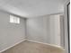 Unfinished basement offers potential with neutral paint, basic window, and ample space for future projects at 3890 S Atchison Way # B, Aurora, CO 80014