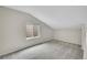 Slanted ceiling bedroom, carpeted floor, window with blind and neutral colored walls at 3890 S Atchison Way # B, Aurora, CO 80014