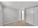 A cozy carpeted bedroom with a closet and natural lighting at 3890 S Atchison Way # B, Aurora, CO 80014