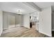 Open dining room with wood floors, chandelier lighting and sliding doors to the patio at 3890 S Atchison Way # B, Aurora, CO 80014
