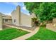 Exterior view of a charming home with siding and a well-kept lawn at 3890 S Atchison Way # B, Aurora, CO 80014