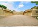 Driveway view of the garages with neutral-colored siding at 3890 S Atchison Way # B, Aurora, CO 80014
