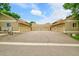 Street view of the garages and neutral-colored siding of the homes at 3890 S Atchison Way # B, Aurora, CO 80014