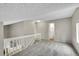 Upstairs landing with carpeted floor, and neutral color walls at 3890 S Atchison Way # B, Aurora, CO 80014