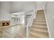 Living room with fireplace, staircase, and wood flooring at 3890 S Atchison Way # B, Aurora, CO 80014