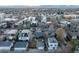 Aerial view of a charming neighborhood showcasing tree-lined streets and diverse architectural styles at 4452 Stuart St, Denver, CO 80212