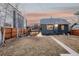 Spacious backyard featuring a patio, outdoor seating, and mature trees, perfect for outdoor enjoyment at 4452 Stuart St, Denver, CO 80212