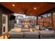 Outdoor patio features cozy seating area with fire pit, ceiling fan, and a view of the backyard at 4452 Stuart St, Denver, CO 80212