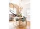 Modern dining room with exposed brick, stylish lighting, and contemporary furnishings at 4452 Stuart St, Denver, CO 80212