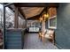 Inviting front porch with seating, decorative tile, and ample natural light at 4452 Stuart St, Denver, CO 80212