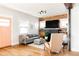 Cozy living room featuring a decorative fireplace, neutral color palette, and ample natural light at 4452 Stuart St, Denver, CO 80212