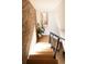 Modern stairway featuring hardwood steps, metal railing and natural light from the window at 4452 Stuart St, Denver, CO 80212