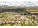 Sweeping aerial view of a town nestled in the mountains with a backdrop of snow-capped peaks at 105 S High St # A, Breckenridge, CO 80424