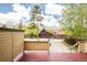 View from the backyard deck showing mature trees and other homes in the neighborhood at 105 S High St # A, Breckenridge, CO 80424