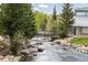 Picturesque creek flowing through Breckenridge, featuring natural rock formations and lush greenery at 105 S High St # A, Breckenridge, CO 80424
