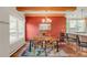 Inviting dining room featuring a wooden table, modern lighting, and a brightly painted accent wall at 105 S High St # A, Breckenridge, CO 80424