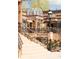 Inviting brick building with wrought iron details, offering a charming entrance and staircase access at 105 S High St # A, Breckenridge, CO 80424
