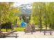 Scenic park view with lush greenery, mountain backdrop, public art, and seating areas for relaxation at 105 S High St # A, Breckenridge, CO 80424
