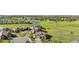 Beautiful aerial view of the home, lush green lawns, golf course, and mature trees at 2600 Reserve Ct, Erie, CO 80516