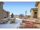 Expansive backyard with patio, lawn, mature trees, and distant views of open fields at 2600 Reserve Ct, Erie, CO 80516