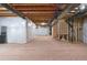 Unfinished basement with open layout, wrapped columns, and exposed ceiling framework at 2600 Reserve Ct, Erie, CO 80516
